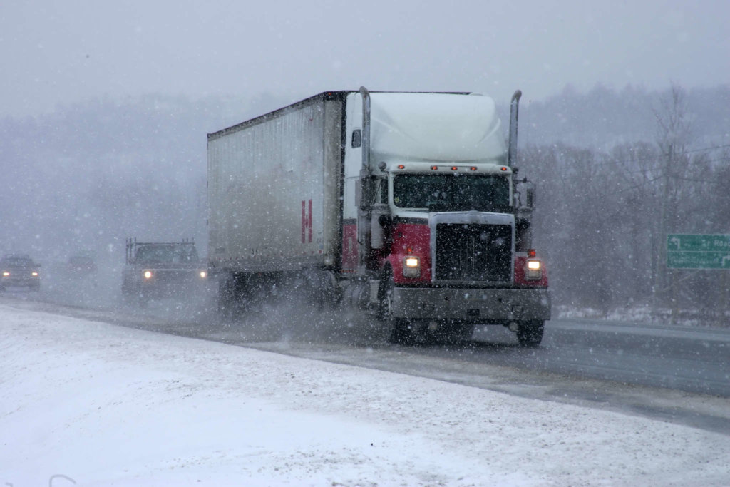 Truck driving in snowy conditions