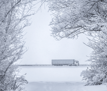 Truck on a snowy road.