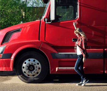 Person standing by their truck.