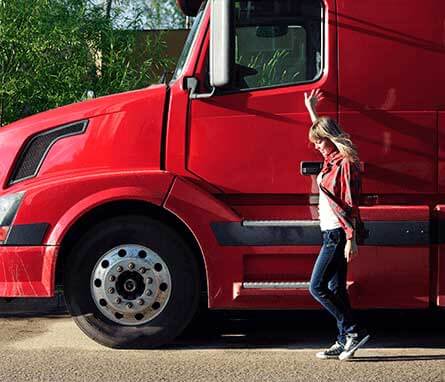 Person standing by their truck.