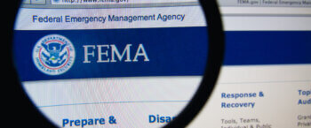 Magnifying glass over the FEMA website