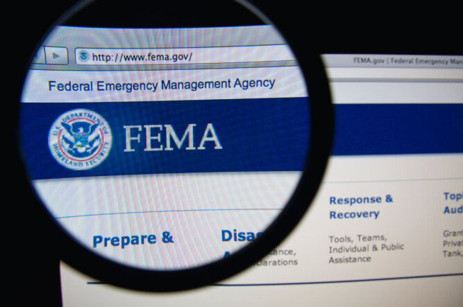 Magnifying glass over the FEMA website