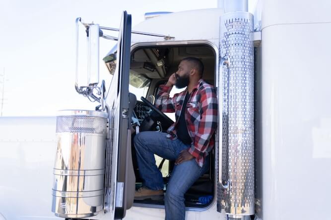 Man sitting in truck cab