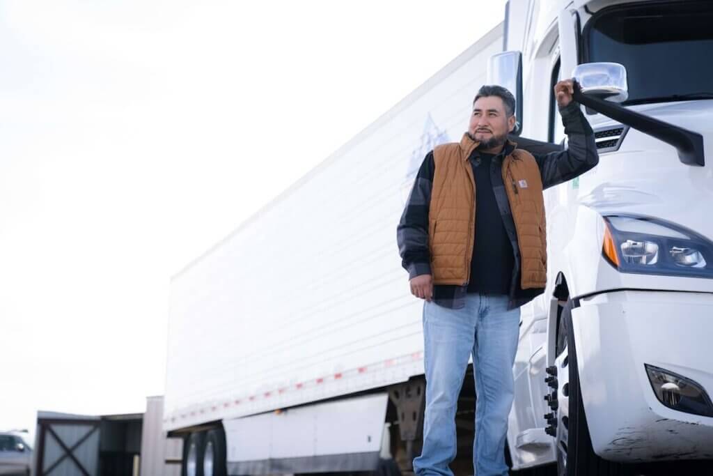Man in front of semi truck