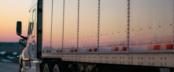 semi truck at dusk on the highway